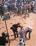Almotamar Net - Martin Adler, a Swedish cameraman wearing a white shirt, collapsed after being shot at an Islamist rally in Mogadishu last June. He died at the scene.