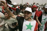 Almotamar Net - HUNDREDS of thousands of Shiites burned and trampled on US flags as they gathered in the Iraqi holy city of Najaf for an anti-American rally called by firebrand cleric Moqtada al-Sadr on the fourth anniversary of the fall of Saddam Hussein.