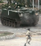 Almotamar Net - Government troops stormed a besieged mosque early Tuesday in Pakistans capital, killing 50 militant students and eight soldiers, officials said.As explosions were still being heard from Islamabads Lal Masjid, or Red Mosque, Gen. Waheed Arshad described the operation as a "slow process" with soldiers battling room by room.