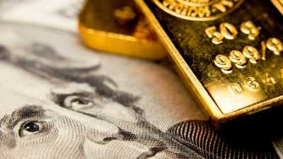 الذهب يتراجع مع ارتفاع الدولار	 